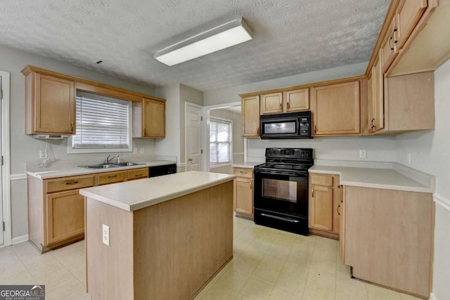 kitchen with black appliances, a center island, light brown cabinets, a textured ceiling, and sink