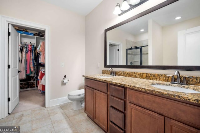 106 Danbury Ct, Pooler, GA 31322 - full bathroom featuring a stall shower, a walk in closet, double vanity, and tile patterned flooring