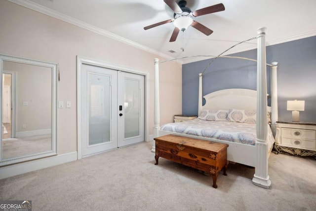 carpeted bedroom featuring french doors, ceiling fan, and crown molding