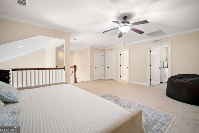 carpeted bedroom featuring ceiling fan and crown molding