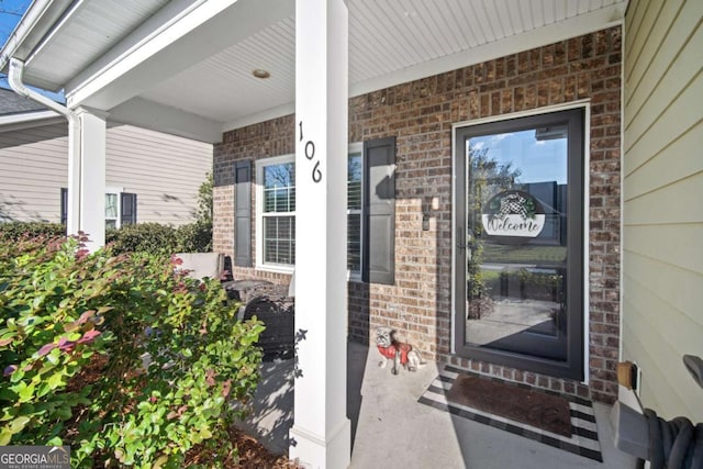 entrance to property featuring a porch