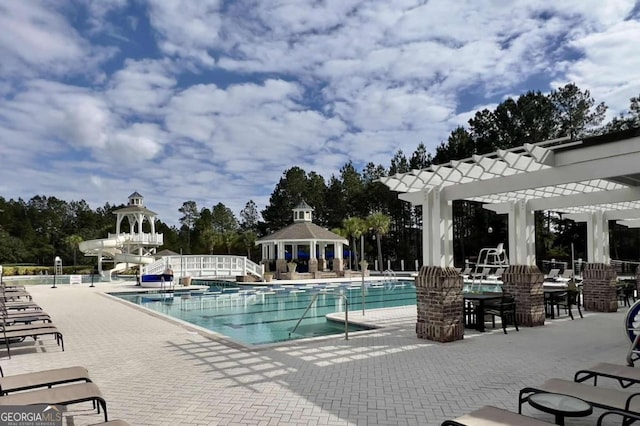 106 Danbury Ct, Pooler, GA 31322 - community pool featuring a pergola, a water slide, a patio area, and a gazebo