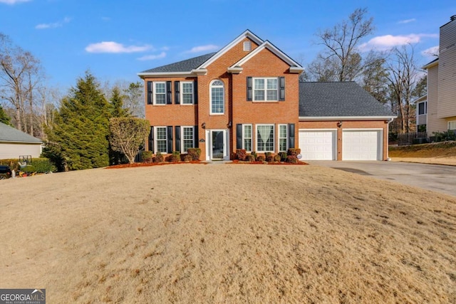 view of front of house with a front lawn and a garage