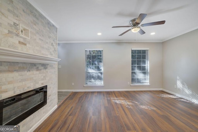 unfurnished living room featuring ornamental molding, ceiling fan, and dark hardwood / wood-style floors