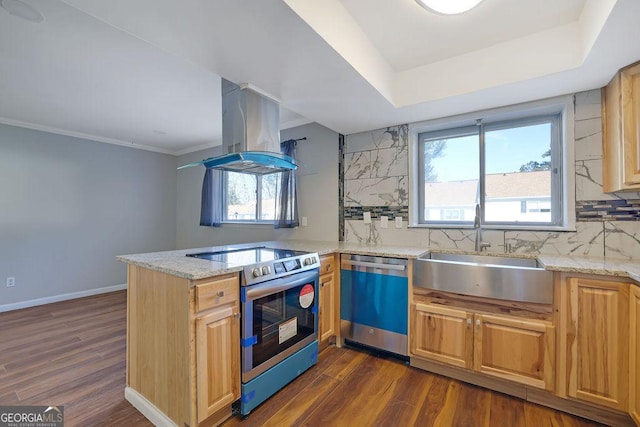 kitchen featuring sink, tasteful backsplash, island exhaust hood, kitchen peninsula, and appliances with stainless steel finishes