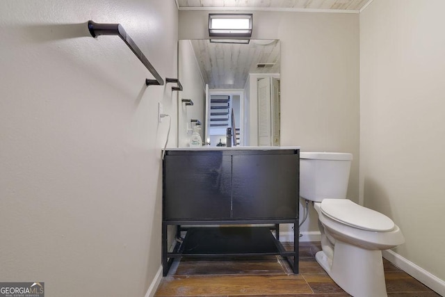 bathroom featuring hardwood / wood-style floors and toilet