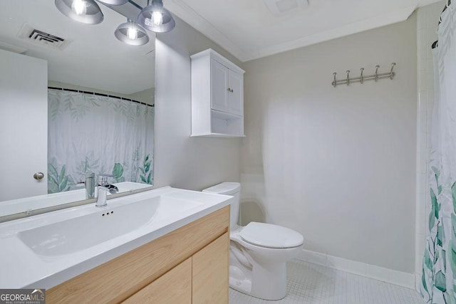 bathroom with toilet, tile patterned flooring, crown molding, and vanity