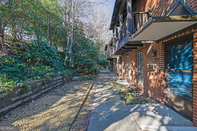 view of yard with a balcony and a patio