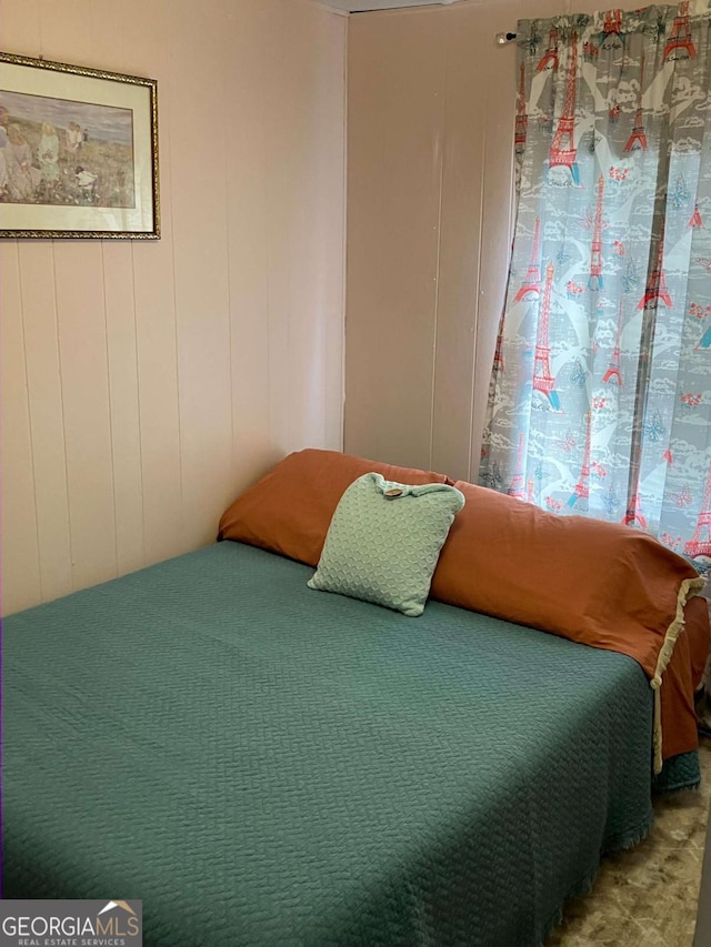 bedroom with wooden walls