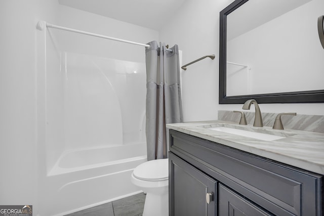 full bathroom with toilet, vanity, and shower / bath combo with shower curtain