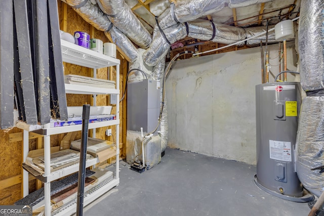 basement featuring electric water heater and heating unit