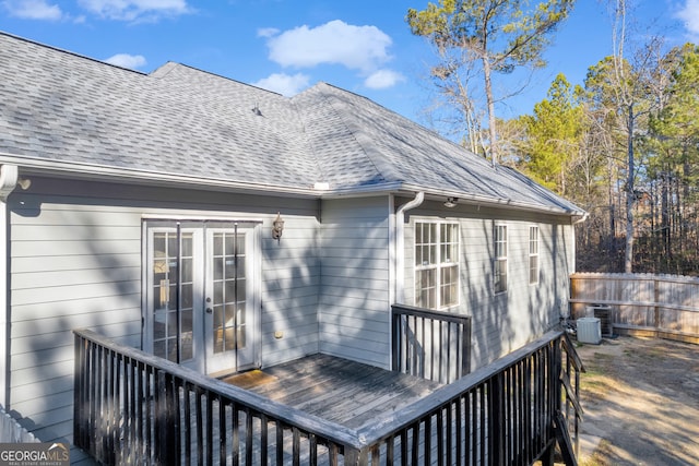 deck with french doors and cooling unit