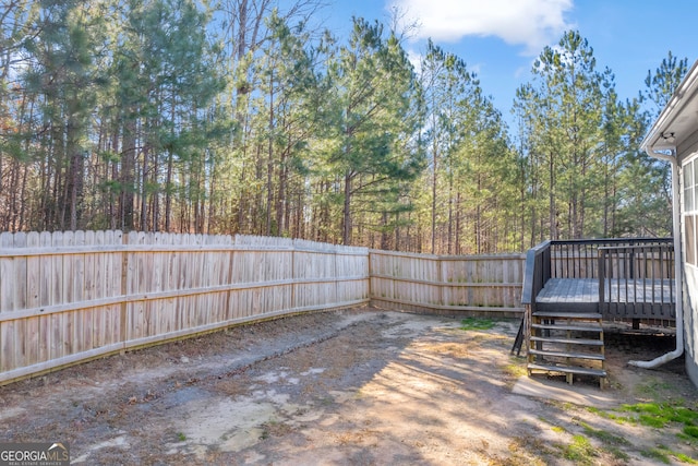 view of yard featuring a wooden deck