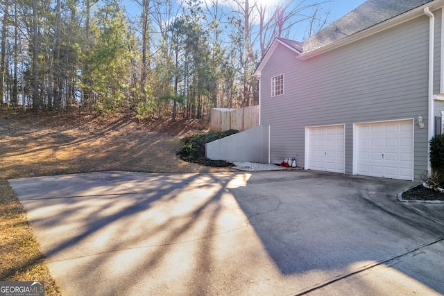 view of side of property featuring a garage