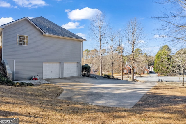 view of side of property with a garage