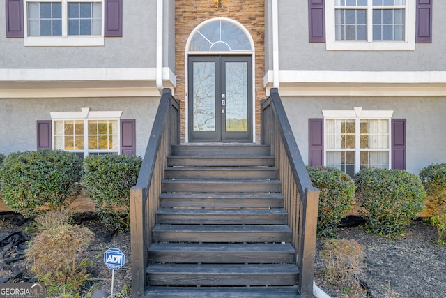 view of exterior entry featuring french doors