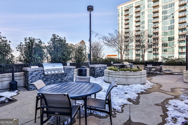 view of patio / terrace featuring a grill and an outdoor kitchen