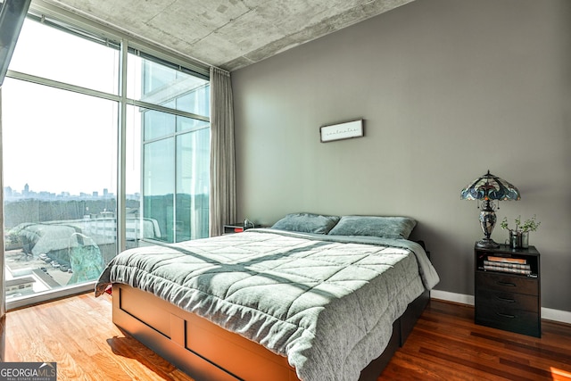 bedroom with dark hardwood / wood-style floors