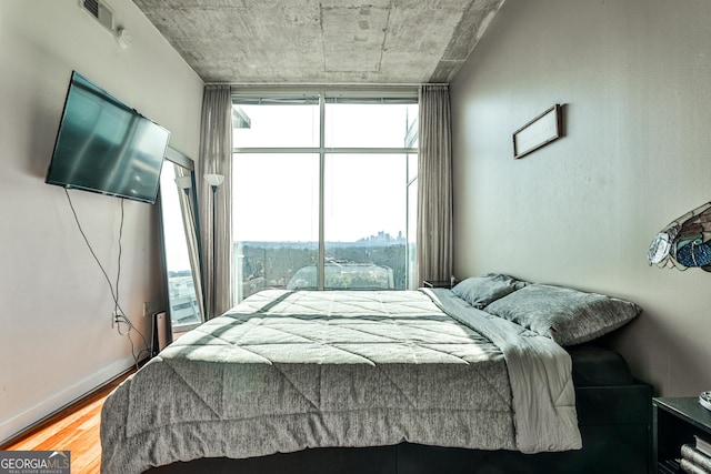 bedroom with hardwood / wood-style flooring