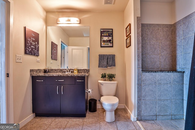 bathroom with toilet and vanity