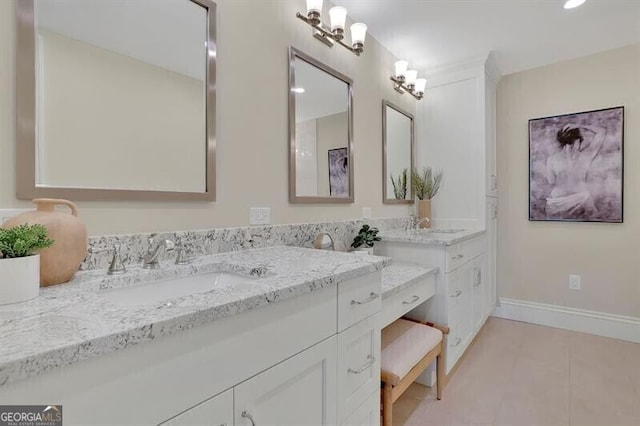 bathroom with tile patterned floors and vanity