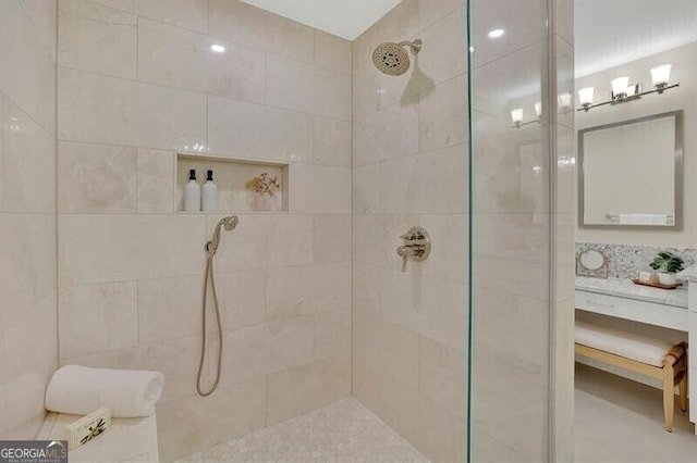 bathroom with a tile shower