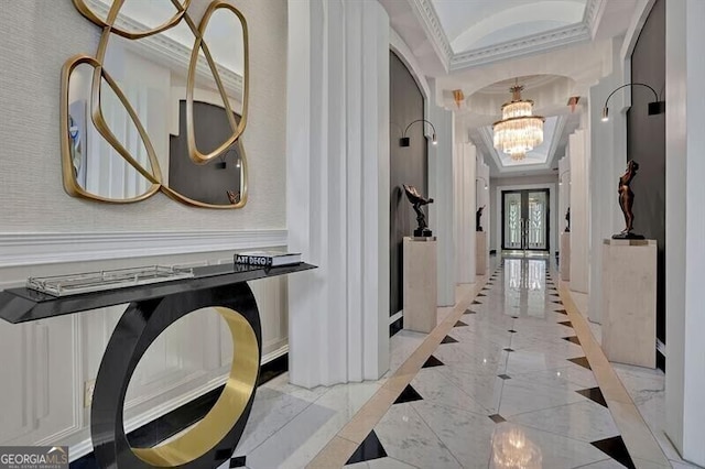 hallway featuring french doors, a notable chandelier, crown molding, and a tray ceiling