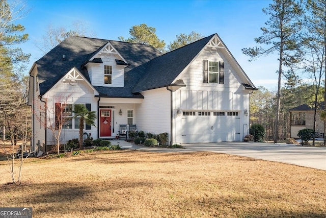 front facade featuring a front yard and a garage