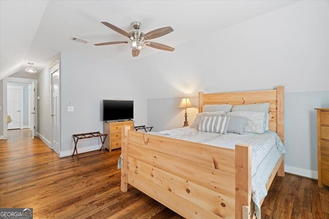 bedroom featuring lofted ceiling, wood-type flooring, and ceiling fan