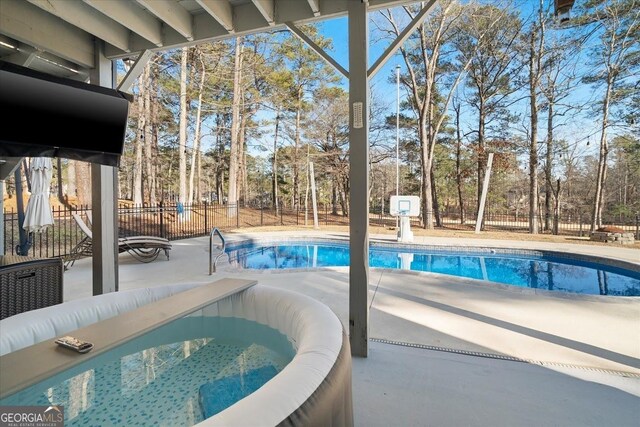 view of patio / terrace featuring a hot tub