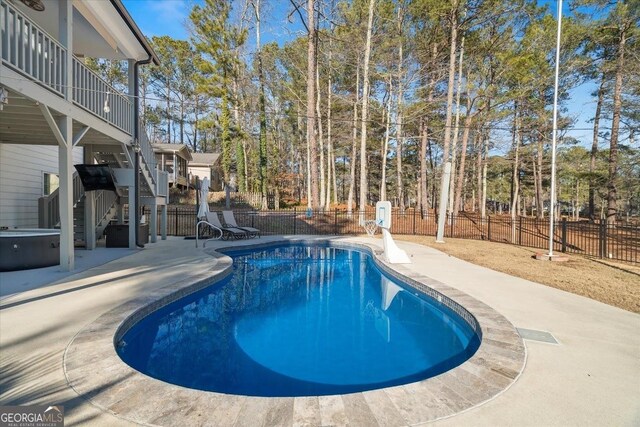 view of swimming pool featuring a patio area