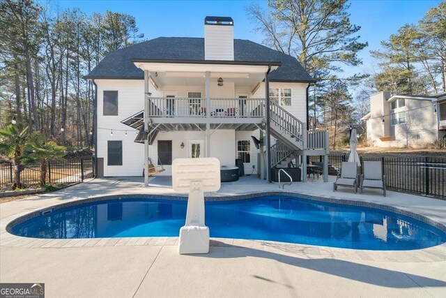 back of house with a patio area and a fenced in pool