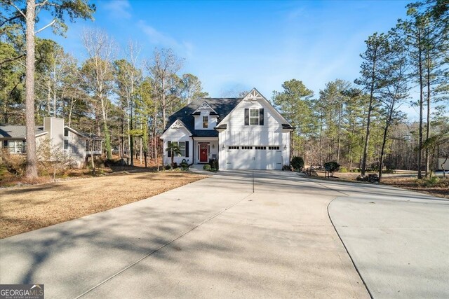 view of front of house with a front lawn and a garage