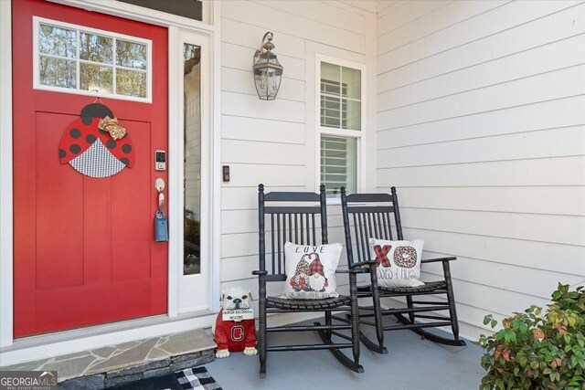 entryway with a chandelier and hardwood / wood-style flooring