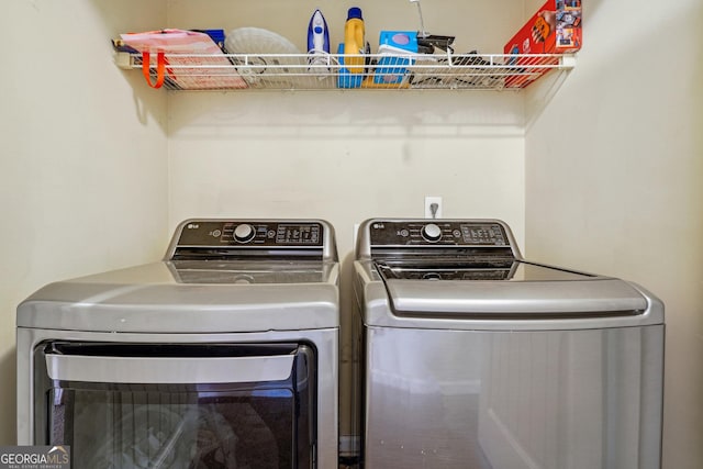 laundry room with washing machine and clothes dryer