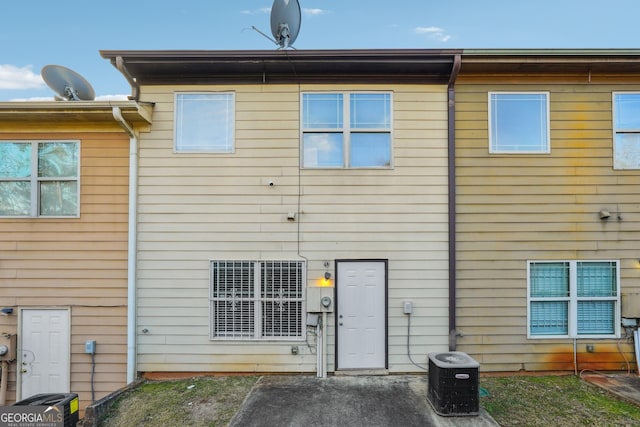 back of house featuring central AC