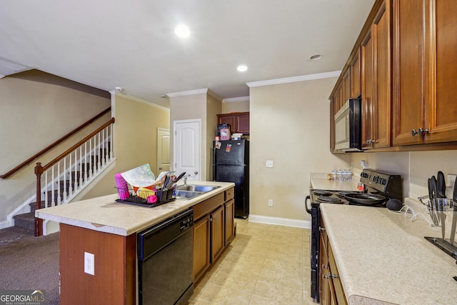 kitchen featuring crown molding, a center island with sink, black appliances, and sink