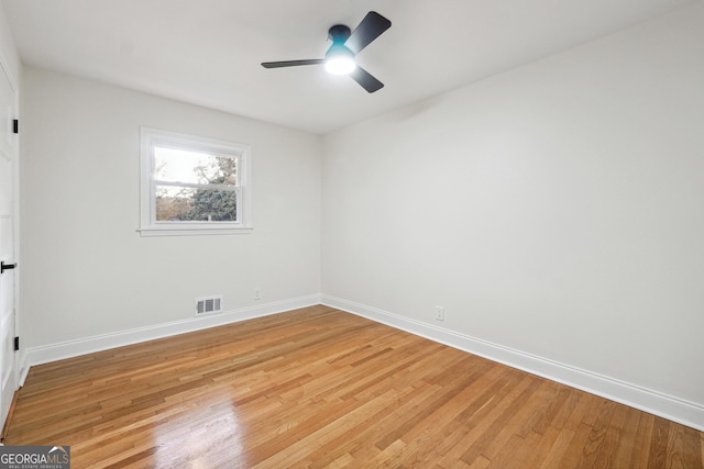 empty room featuring ceiling fan and light hardwood / wood-style floors