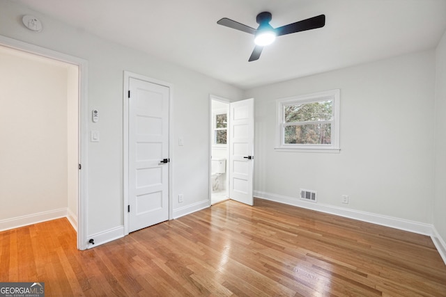 unfurnished bedroom featuring ceiling fan and light wood-type flooring