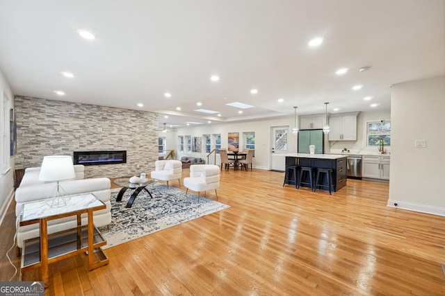 living room featuring light hardwood / wood-style floors and a fireplace