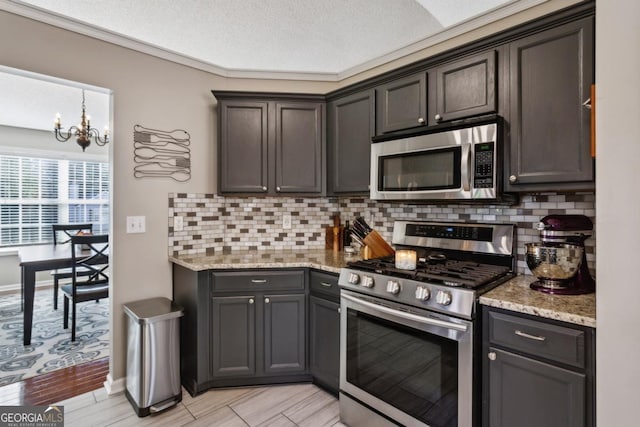 kitchen featuring dark brown cabinets, stainless steel appliances, and tasteful backsplash