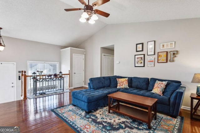 living room featuring ceiling fan, lofted ceiling, and hardwood / wood-style floors