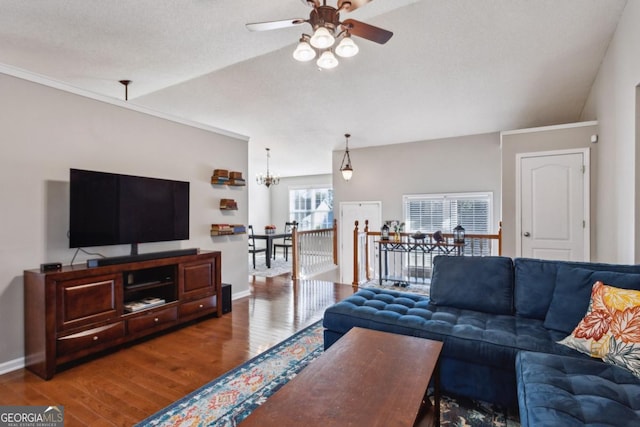 living room featuring a textured ceiling, lofted ceiling, ceiling fan with notable chandelier, and hardwood / wood-style floors