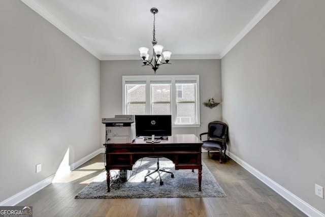 office space with an inviting chandelier, ornamental molding, and light hardwood / wood-style floors