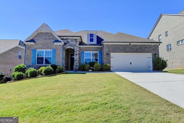 view of front of home with a front lawn and a garage