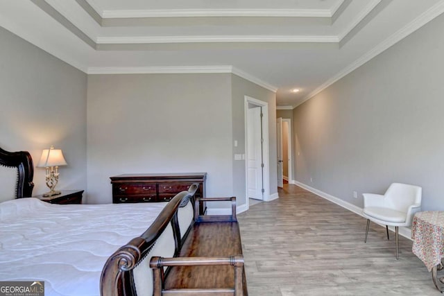 bedroom with ornamental molding and wood-type flooring