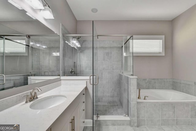 bathroom with vanity, tile patterned flooring, and independent shower and bath