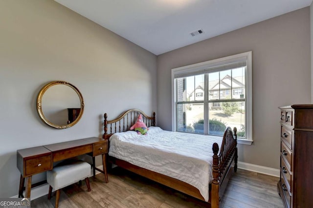 bedroom featuring hardwood / wood-style floors