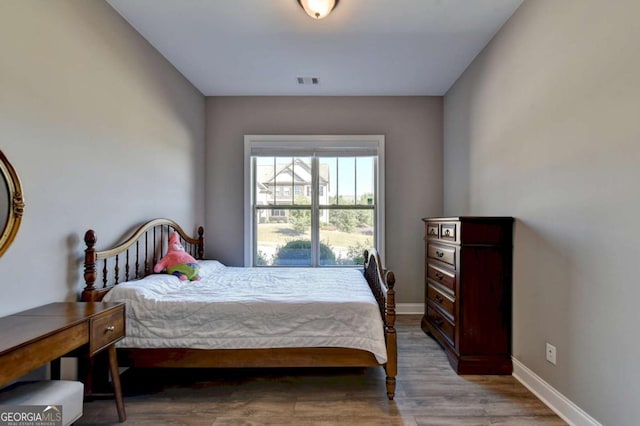 bedroom featuring hardwood / wood-style floors