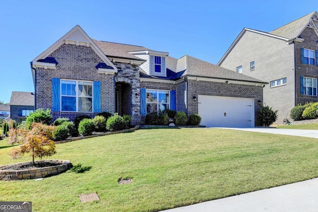 view of front of home with a front yard and a garage